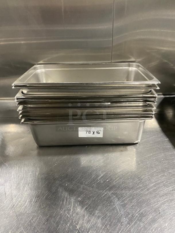 Stack of commercial stainless steel hotel pans. Dimensions: Approximately 10x18 inches. Label reads "78 X 18."