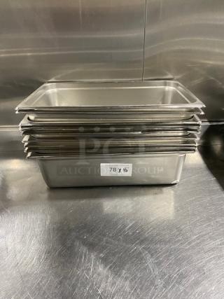 Stack of commercial stainless steel hotel pans. Dimensions: Approximately 10x18 inches. Label reads "78 X 18."
