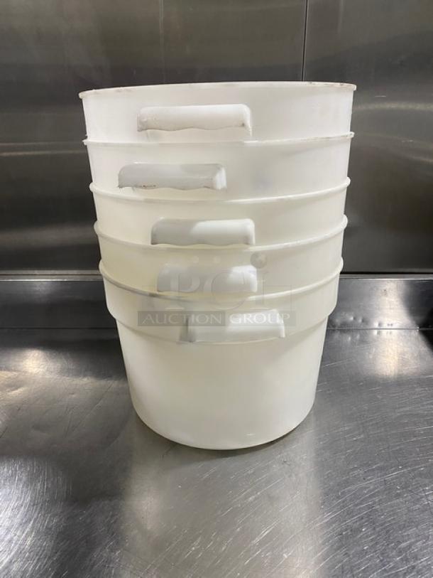 Set of 5 commercial white round food storage containers with handles, stackable design, good condition, ideal for bulk storage.