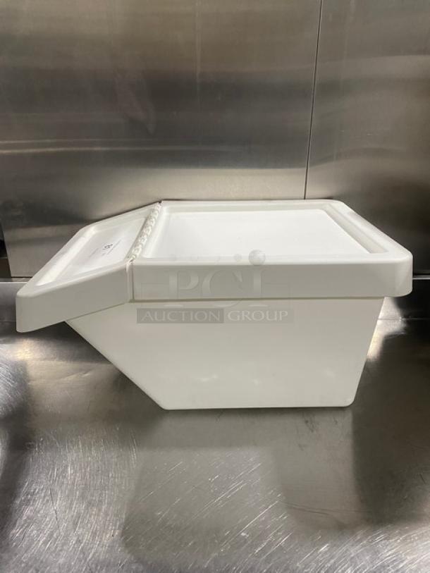 Commercial white stackable countertop food ingredient bin, durable plastic, good condition, with sliding lid and smooth finish.
