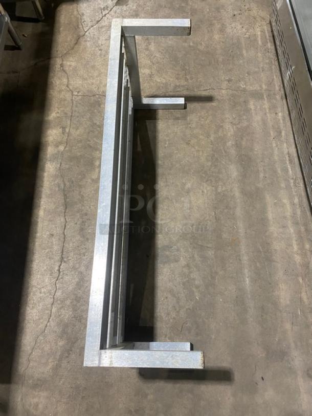 Commercial heavy-duty dunnage rack on legs, metal construction. Used condition, suitable for warehouse storage.