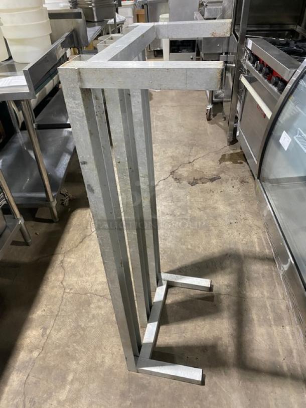 Commercial heavy-duty dunnage rack with metal frame and four legs, suitable for storage. Used, in good condition.