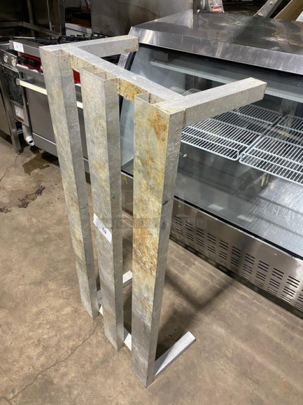 Commercial heavy duty dunnage rack on legs, metal construction, used condition with visible rust. Ideal for sturdy storage.