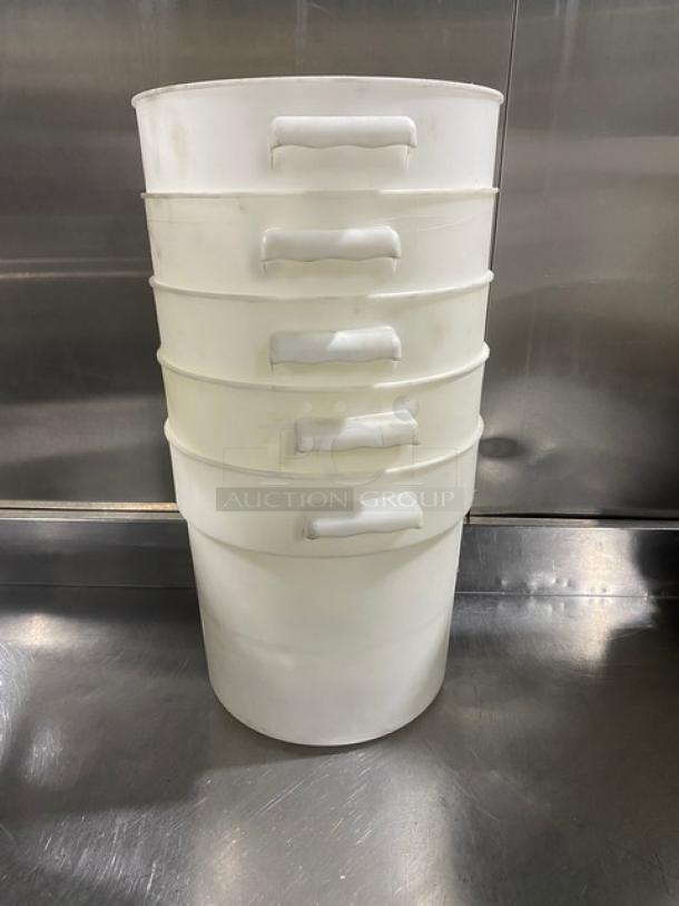 Commercial white round food storage container with handles, stackable, set of five, durable plastic, ideal for bulk storage.