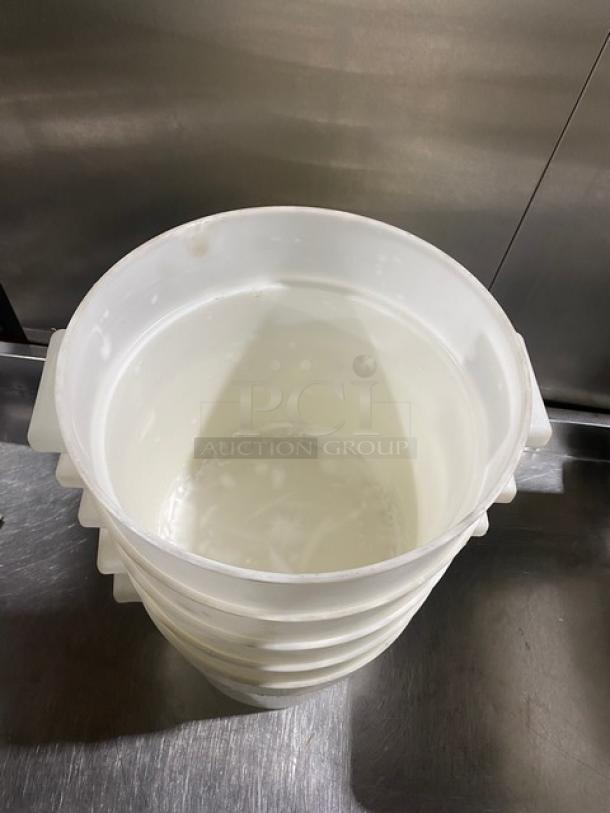 White round commercial food storage container with handles, shown stacked. Appears in good condition.