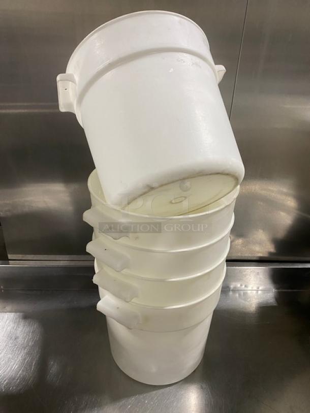 Commercial white round food storage containers with handles, stacked. Durable plastic, used, suitable for bulk storage.