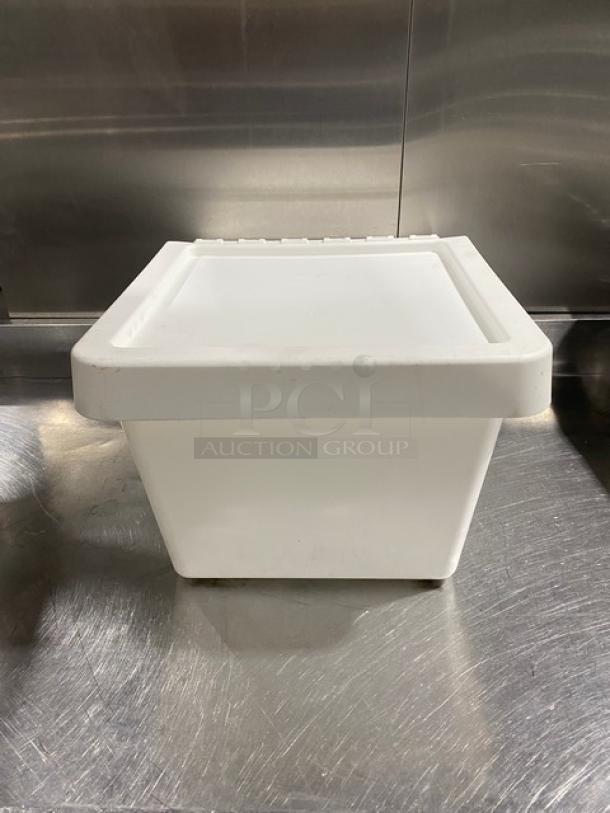 Commercial white stackable countertop food ingredient bin, pristine condition, durable plastic, ideal for kitchen storage.
