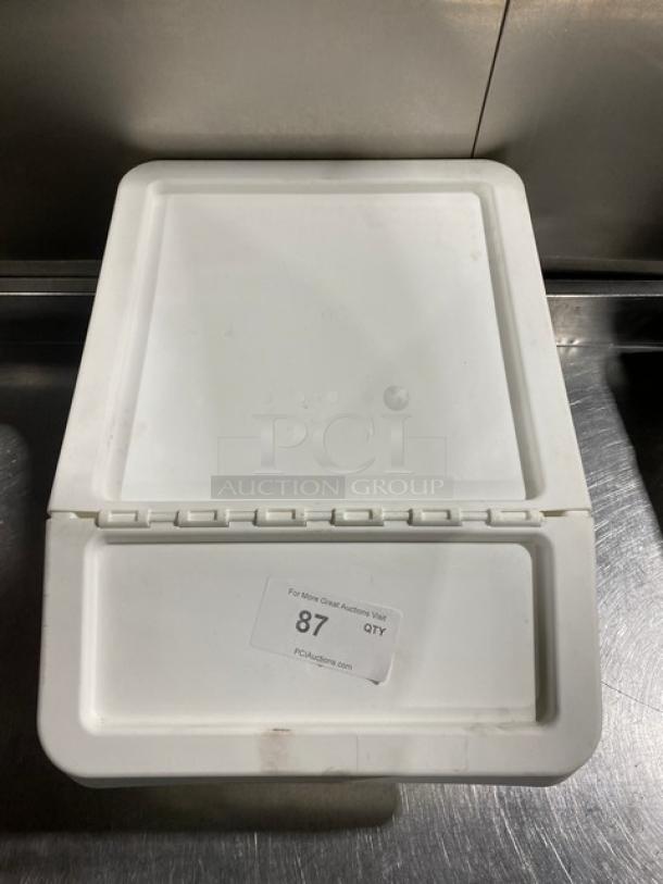 Commercial white stackable countertop food ingredient bin with hinged lid, marked 87. Ideal for kitchen storage.