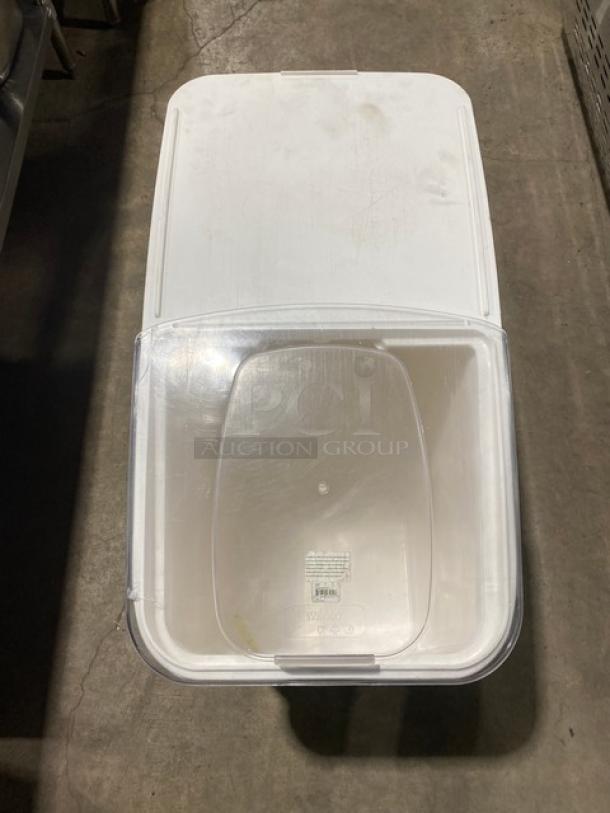 Winco white portable food ingredient storage bin with clear lid on casters. Used condition, visible label.