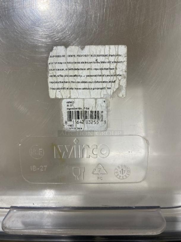 Winco commercial white storage bin with clear lid, on casters. Features Winco branding, text detailing California Prop 65 warning.