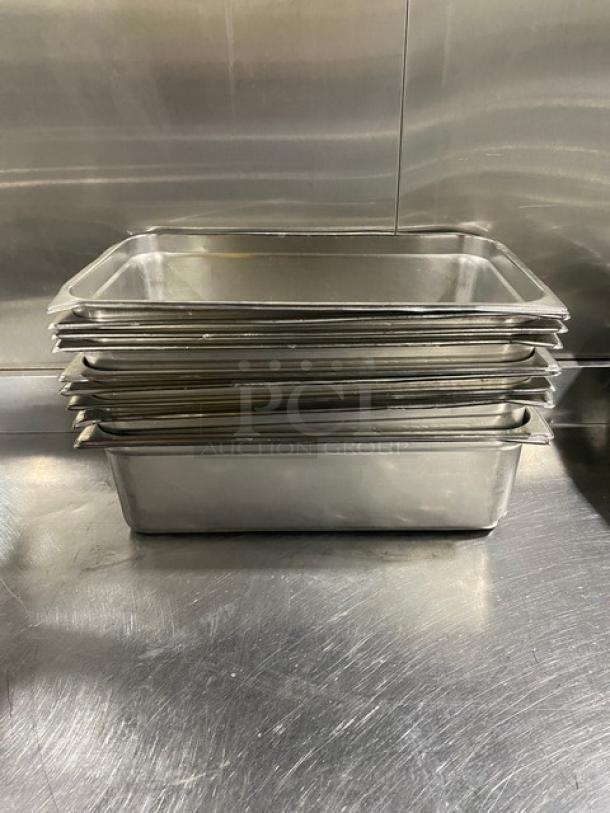 Commercial stainless steel hotel steamtable pans, stacked. Durable, high-quality, excellent condition, perfect for catering use.