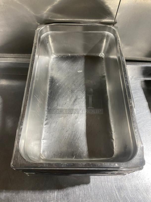 Stainless steel hotel steamtable pan in good condition; visible minor surface scratches. Dimensions unspecified.