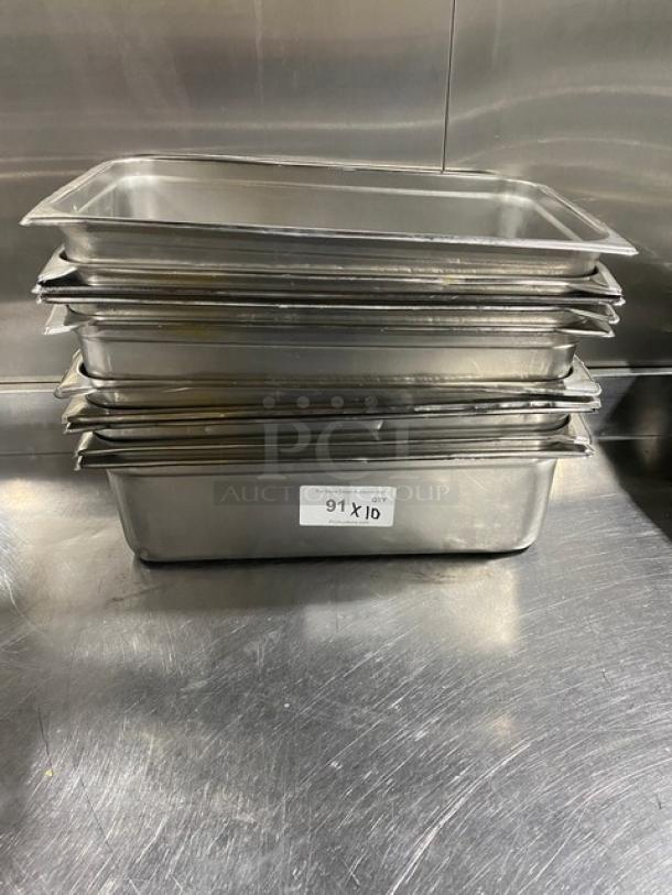 Stack of commercial stainless steel hotel pans in good condition, labeled with "91 X 10" for quantity.