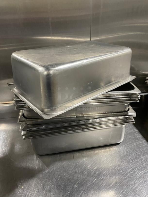 Commercial stainless steel hotel/steamtable pans, stack of ten, used condition. Ideal for catering, durable and versatile.