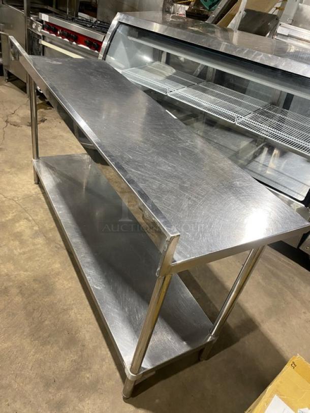Commercial stainless steel worktop table with undershelf and up-turned back splash, on sturdy legs, excellent condition.