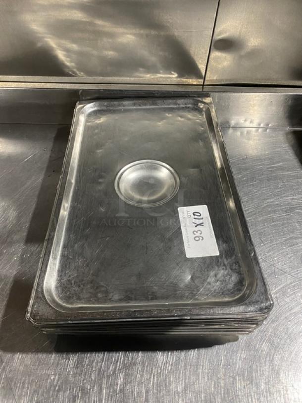 Stainless steel steamtable pan lid, lightly used, measuring 10x. Features a central indentation. Label marked "93 X10."