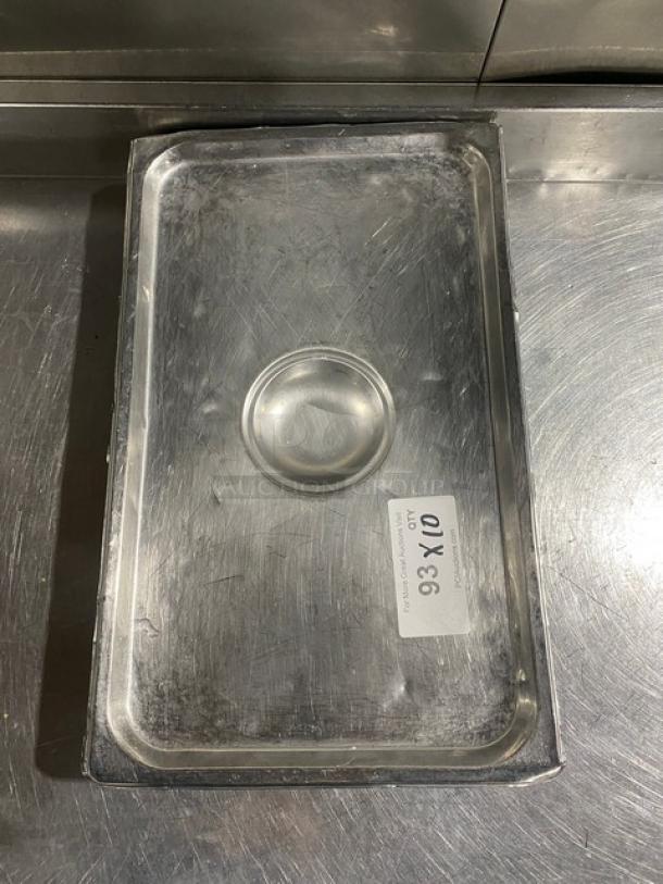 Commercial stainless steel hotel steamtable pan lid, used condition, features thumb grip. Label reads "93X10."