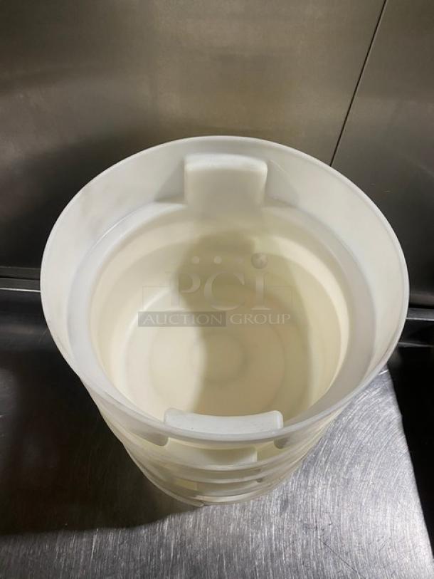 Commercial white round food storage container with handles, in good condition.