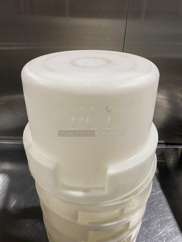 White round commercial food storage container with handles, durable plastic, stackable, suitable for bulk storage.