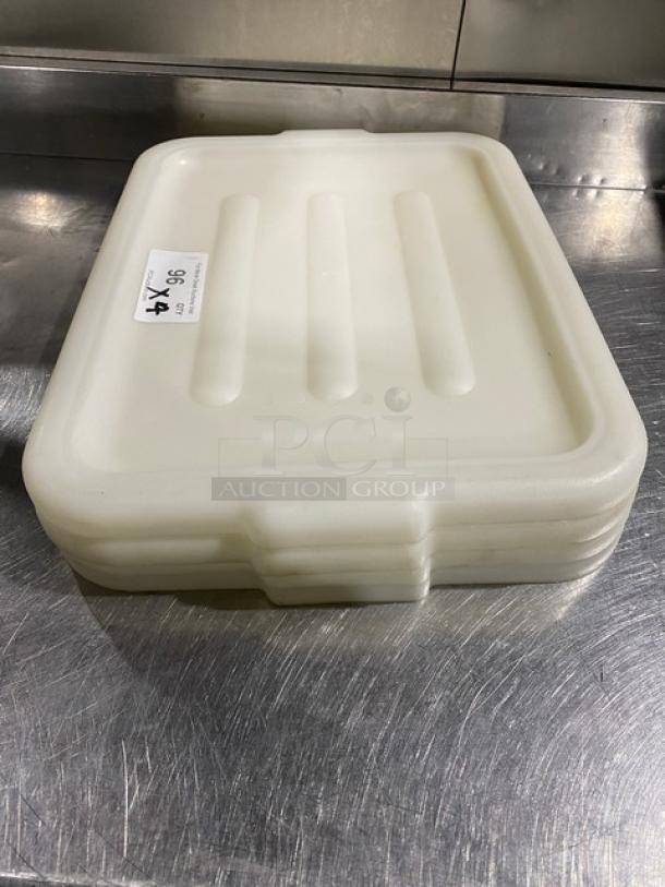 White rectangular commercial food storage container with handled lid, stackable design, new condition, auction lot of four.