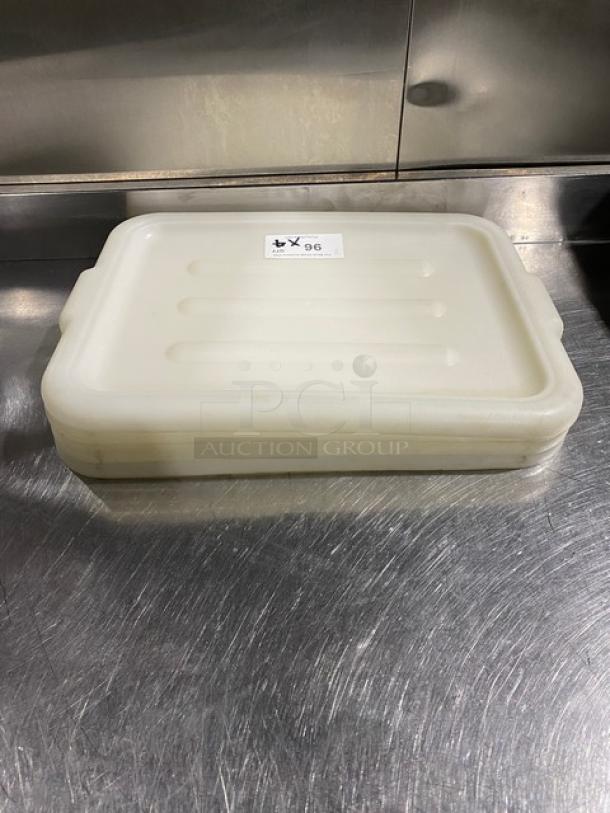 Commercial white rectangular food storage container with handled lid. Includes label marked "4X". Excellent condition.