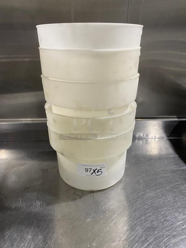 Commercial white round food storage container with handles, stacked, used condition. Tag reads "97 X 5."