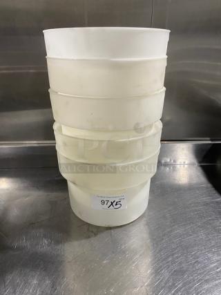 Commercial white round food storage container with handles, stacked, used condition. Tag reads "97 X 5."