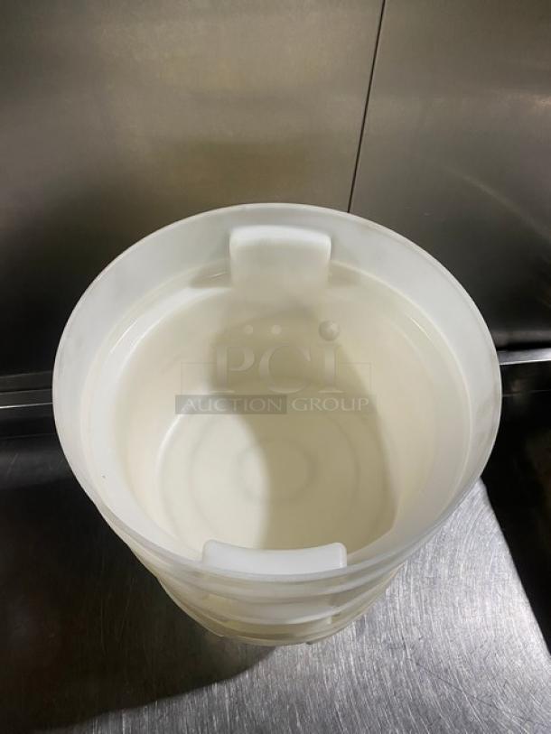 White round commercial food storage container with handles, stackable design. Appears in good condition, ideal for kitchen use.