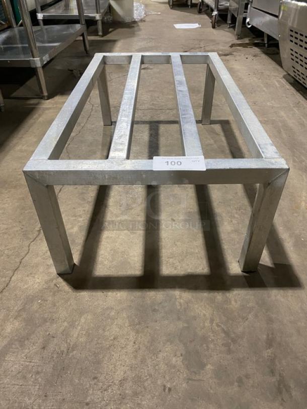Commercial heavy-duty dunnage rack with sturdy legs. Made of metal, excellent condition, ideal for storage support.