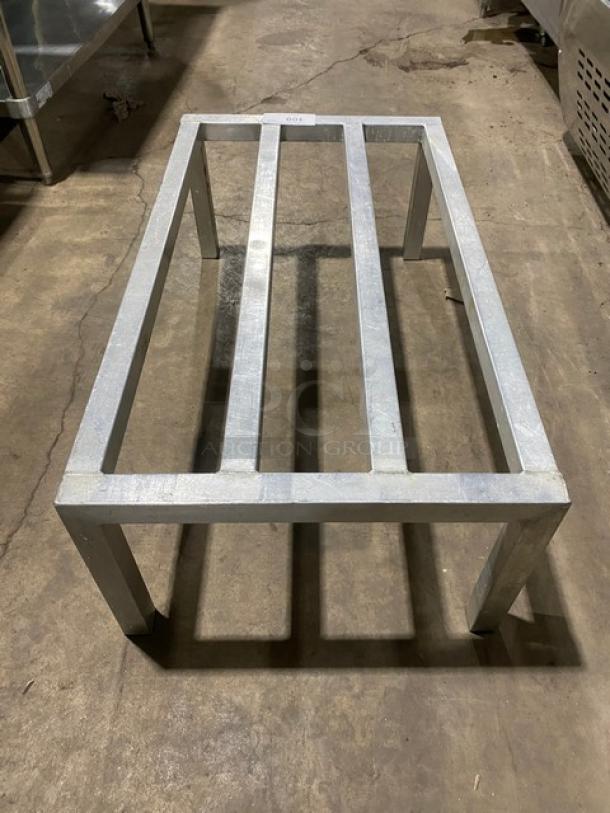 Commercial heavy-duty aluminum dunnage rack with four legs. Excellent condition, sturdy design for optimal storage support.