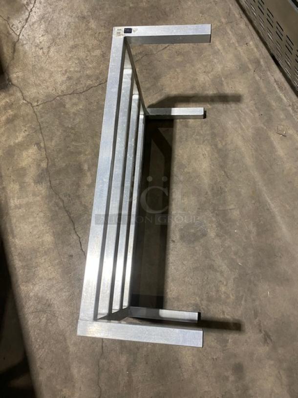 Heavy-duty commercial dunnage rack on legs, metal construction, in excellent condition, ideal for storage solutions.