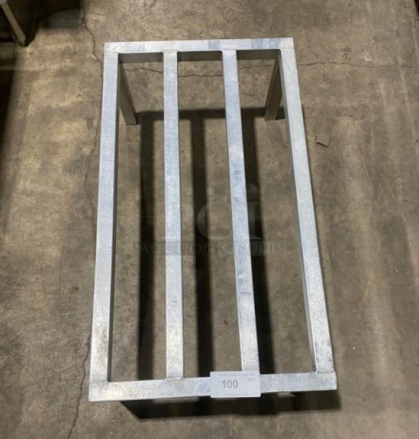 Commercial heavy-duty dunnage rack with metal slats and sturdy legs. Appears in good condition. Label reads "100 QT".