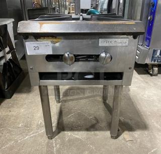 U.S. Range stainless steel single burner stock pot range, natural gas powered, with gas hose connection, on legs.