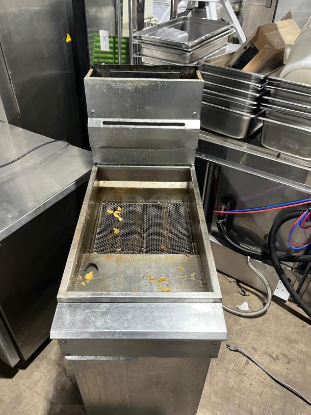 DCS commercial stainless steel natural gas deep fat fryer with back splash, basket hanger, and legs. Used condition.