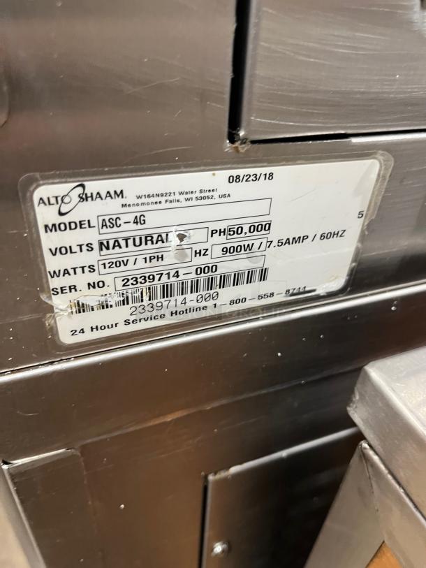 Alto-Shaam ASC-4G convection oven label, 2018 model, natural gas, 120V, serial 2339714-000, stainless steel with casters.