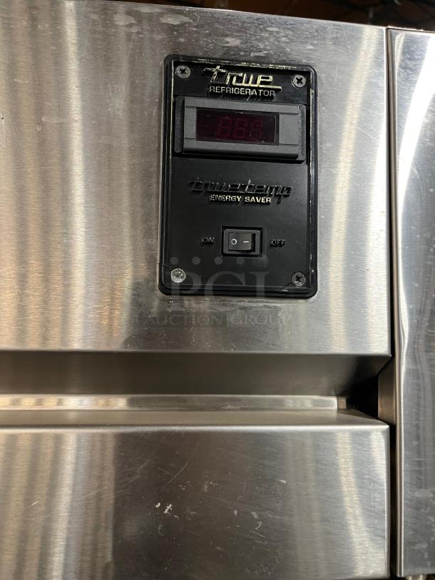 True TG1R-1S stainless steel refrigerator, single door, poly coated rack, on casters, visible TrueTemp energy saver display.