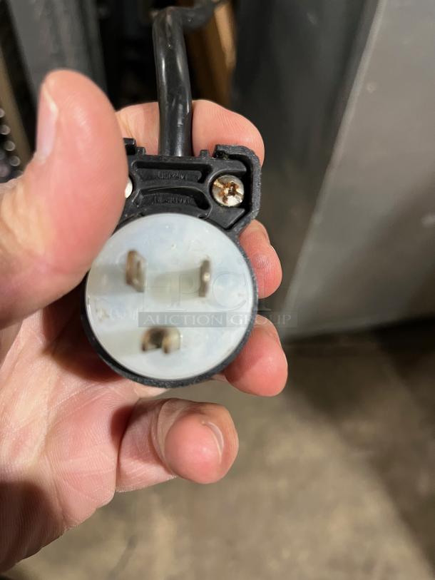 Close-up of a power plug for the True TG1R-1S refrigerator, showing a 115V, 1-phase connection.