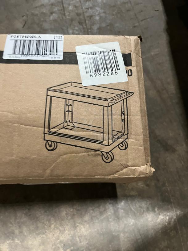 NEW Rubbermaid Commercial 2-Tier Utility Pushcart, Model FG9T6600BLA, in original box with product illustration and labels.