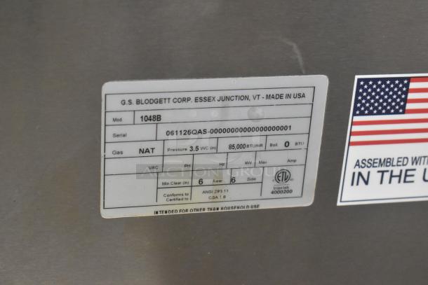 Blodgett 1048B stainless steel commercial pizza oven, natural gas, model tag showing serial number and specifications.