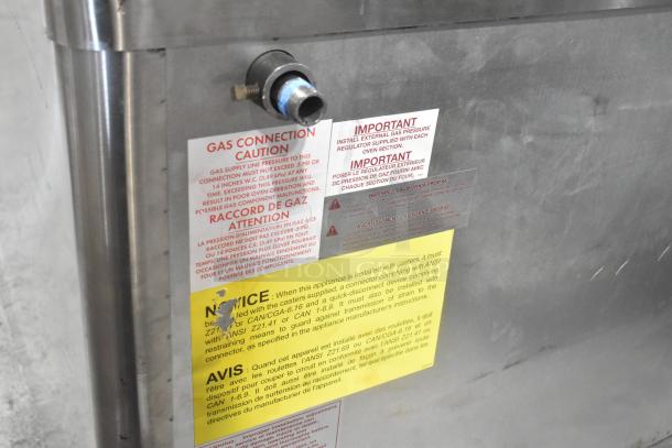 Blodgett 1048B stainless steel commercial single deck pizza oven. Gas connection and safety labels visible. Model: 1048B.
