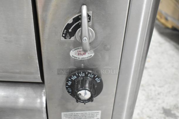 Blodgett 1048B stainless steel pizza oven with temperature dial and operation labels, natural gas powered.