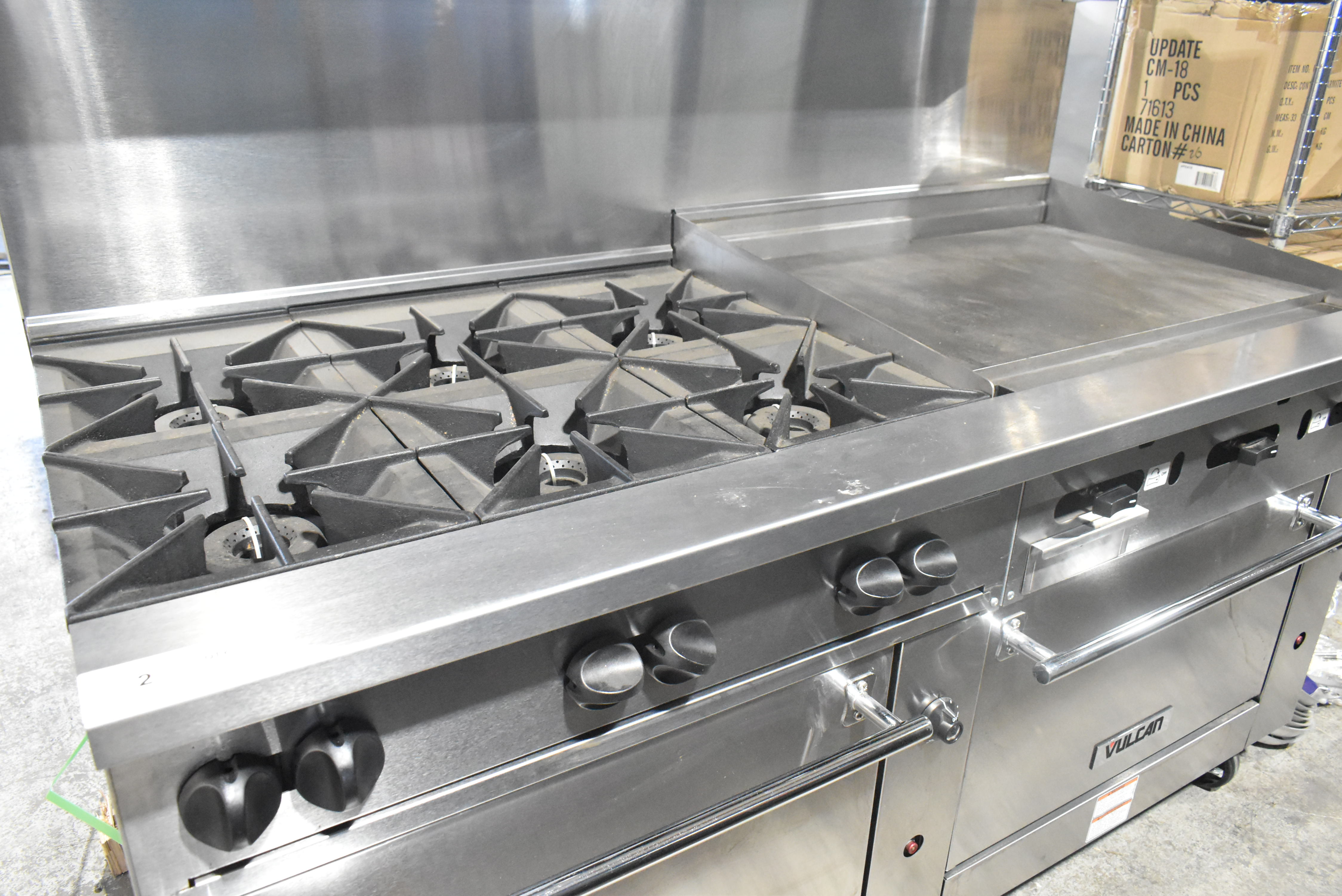 Commercial range burner assembly showing spider jets and flame distribution