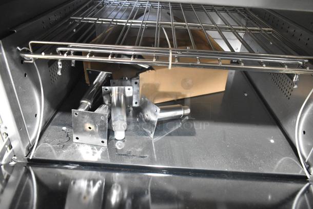 Vulcan 72SS-6B36GP commercial range components inside the oven, showing stainless steel parts and racks.