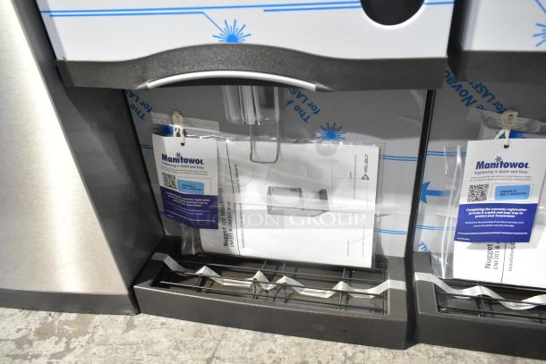 Brand new Manitowoc CNF0201A-161L stainless steel countertop nugget ice maker, 10 lb bin, lever dispensing, tags visible.