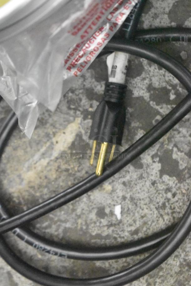 Close-up of a power plug and cord for a 2022 Manitowoc CNF0201A-161L commercial nugget ice maker, brand new condition.