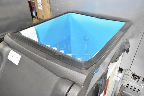 Manitowoc D420 stainless steel ice bin, brand new, 383 lbs capacity. Slight scratch and dent, visible label shows "6 QTY".