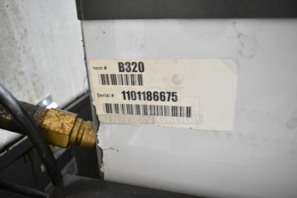 BRAND NEW SCRATCH AND DENT! Manitowoc B320 Stainless Steel Ice Bin, 210 lb capacity, item and serial numbers visible.