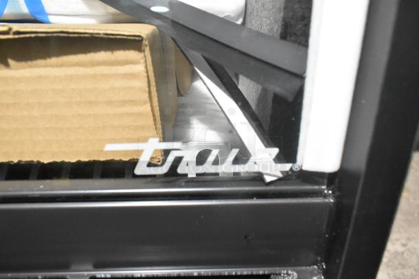 Brand new True TGM-R-36-SC/SC-S-S bakery case, curved glass, 2021 model, 115V, 1 phase, minor scratches and dents visible.