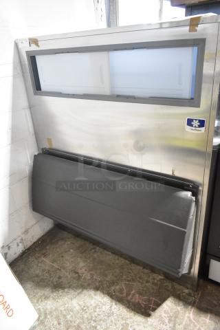 Brand new Manitowoc stainless steel commercial ice bin, scratch and dent condition, features front access door.