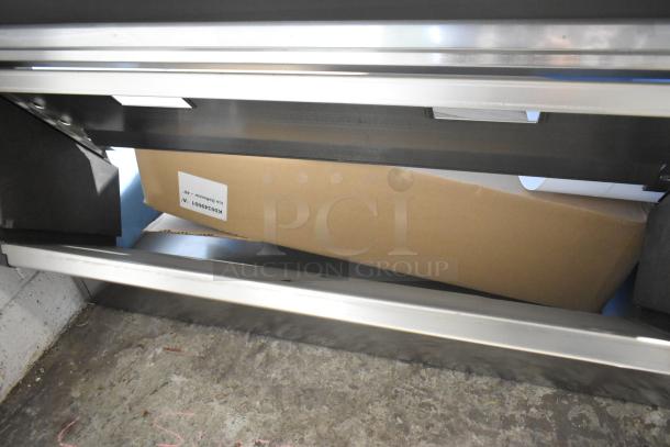 BRAND NEW SCRATCH AND DENT Manitowoc Stainless Steel Commercial Ice Bin, visible packaging with label.
